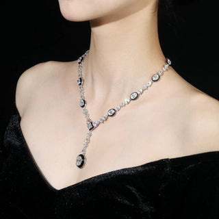 Royal Enamel Monochrome Necklace in sterling silver with platinum finish and white crystal centerpiece, displayed against a neutral background