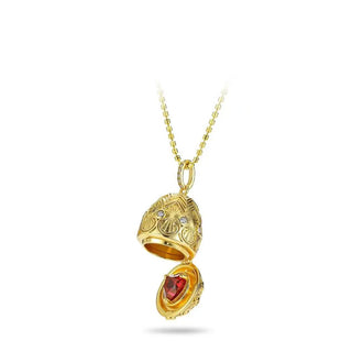 Golden Goose Egg Chain in gold-toned sterling silver with a central red gemstone, suspended on a vintage-style O-chain, displayed against a clean backdrop