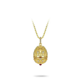Golden Goose Egg Chain in gold-toned sterling silver with a central red gemstone, suspended on a vintage-style O-chain, displayed against a clean backdrop