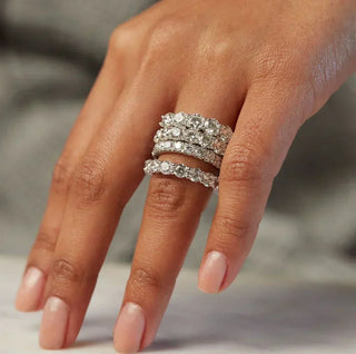 Diamond eternity ring stack worn on hand, featuring layered white diamond bands in a luxury jewellery style