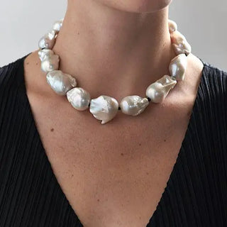 Close-up of a large baroque pearl necklace with irregular-shaped pearls, showcasing unique baroque pearl jewelry design.