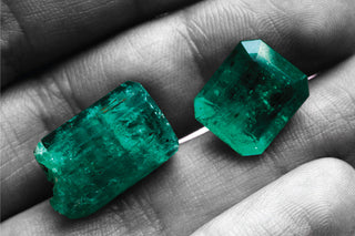 Various types of emeralds displayed side by side, highlighting differences in color, clarity, and origin.
