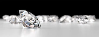Confident woman wearing a sparkling diamond ring on her own hand, celebrating independence and self-love.