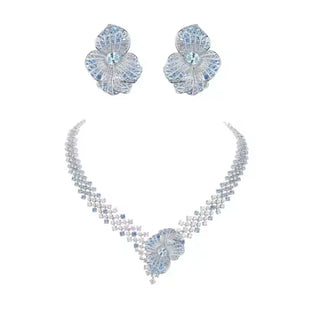 Arctic Bloom Necklace Suite in sterling silver with platinum plating and lab-created sapphires, resembling delicate frozen petals.