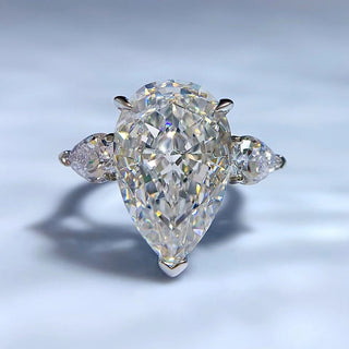 Sterling silver ring featuring a 5-carat champagne-colored pear-cut lab sapphire in a classic prong setting.