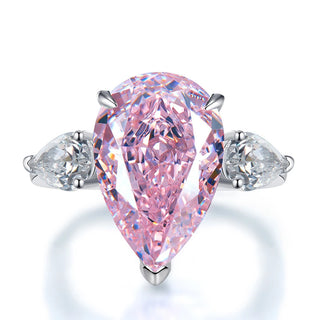 Sterling silver ring featuring a 5-carat champagne-colored pear-cut lab sapphire in a classic prong setting.