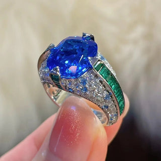 Jewel of the Realm Ring in sterling silver with deep blue and emerald lab sapphires, regal cocktail ring design

