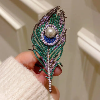 Noble Peacock Feather Brooch – copper-silver alloy with freshwater pearl and multicolored lab sapphires in green, blue, and purple.