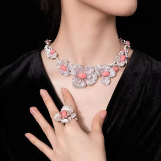 Pink Blossom Floral Necklace with soft pink lab sapphires and sterling silver, capturing the elegance of blooming petals.

