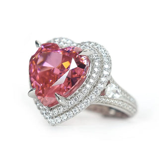 Sugar Crush Heart Ring by Azzallure featuring a pink heart-shaped lab sapphire surrounded by sparkling lab sapphires in platinum-plated sterling silver.

