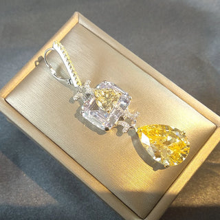 Sunveil Earrings in sterling silver with yellow lab sapphires, offering a delicate shimmer of sunlight-inspired elegance.