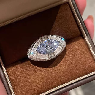 Pharaoh’s Eye Ring by Azzallure featuring a vivid royal blue lab sapphire in a bold sterling silver setting with intricate detailing.

