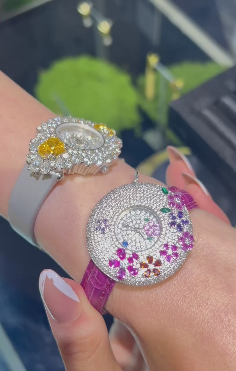 Blossom Hour Watch for women with a 44 mm pink dial, silver case, and sapphire crystal window.