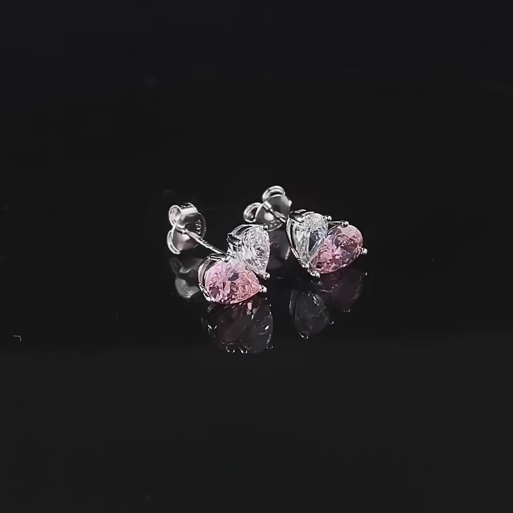Half Of My Heart Earrings in sterling silver with pink and white lab sapphires, symbolizing love and connection.